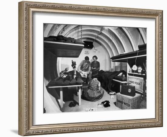 Interior View of Steel Underground Radiation Fallout Shelter Where Couple Relaxes with 3 Children-Walter Sanders-Framed Photographic Print