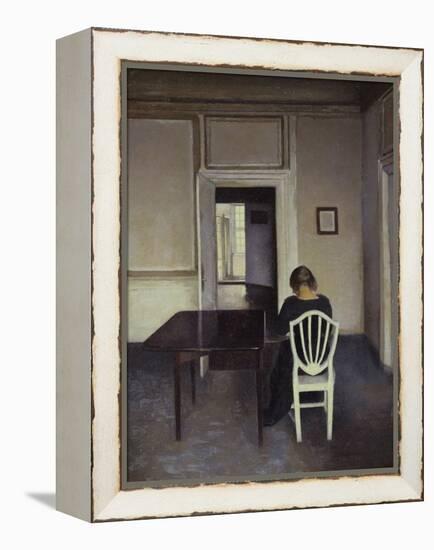 Interior with a Woman Seated on a White Chair-Vilhelm Hammershoi-Framed Premier Image Canvas