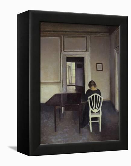 Interior with a Woman Seated on a White Chair-Vilhelm Hammershoi-Framed Premier Image Canvas