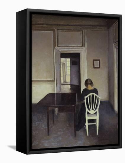 Interior with a Woman Seated on a White Chair-Vilhelm Hammershoi-Framed Premier Image Canvas