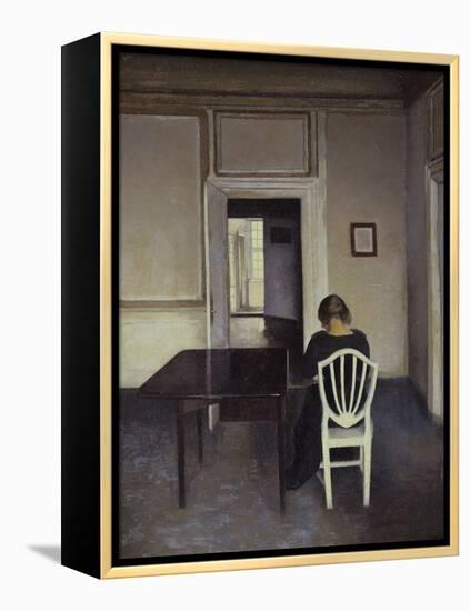 Interior with a Woman Seated on a White Chair-Vilhelm Hammershoi-Framed Premier Image Canvas