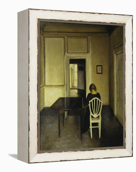 Interior with a Woman Seated on a White Chair-Vilhelm Hammershoi-Framed Premier Image Canvas