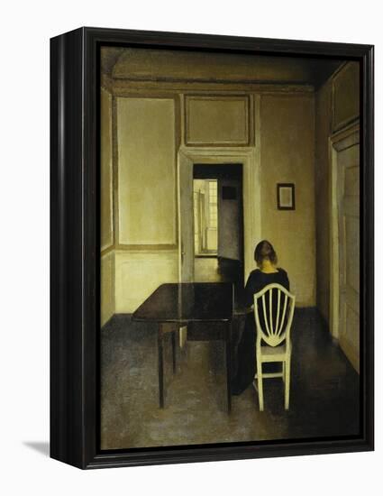 Interior with a Woman Seated on a White Chair-Vilhelm Hammershoi-Framed Premier Image Canvas