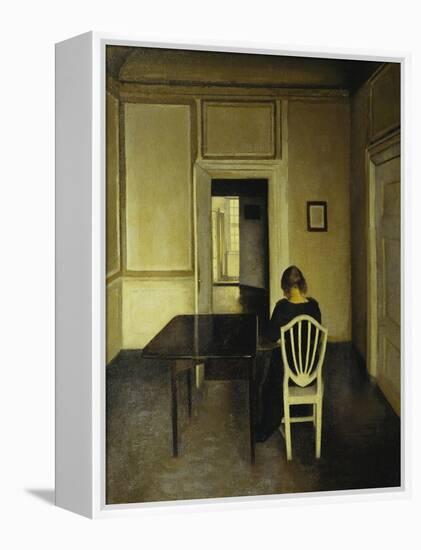 Interior with a Woman Seated on a White Chair-Vilhelm Hammershoi-Framed Premier Image Canvas