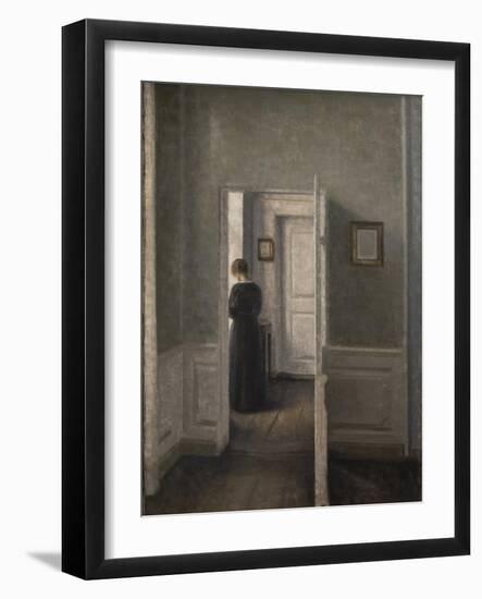 Interior with a woman standing-Vilhelm Hammershoi-Framed Giclee Print