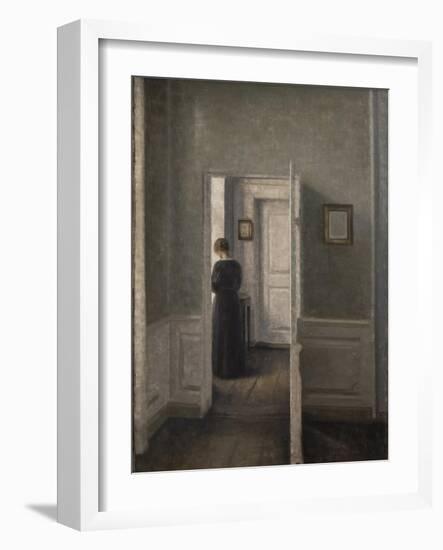 Interior with a woman standing-Vilhelm Hammershoi-Framed Giclee Print