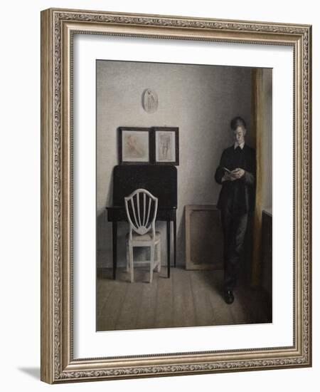 Interior with a young man reading, 1898-Vilhelm Hammershoi-Framed Giclee Print