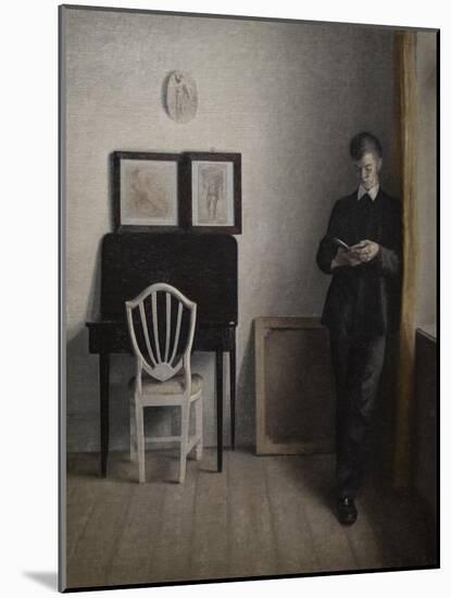 Interior with a young man reading, 1898-Vilhelm Hammershoi-Mounted Giclee Print