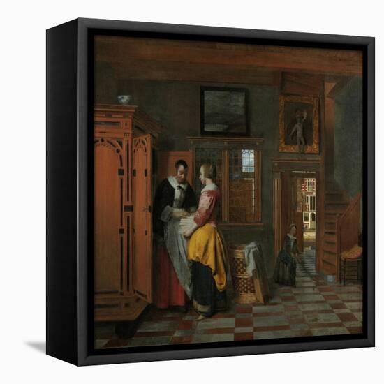 Interior with Women Beside a Linen Chest, 1663-Pieter de Hooch-Framed Premier Image Canvas