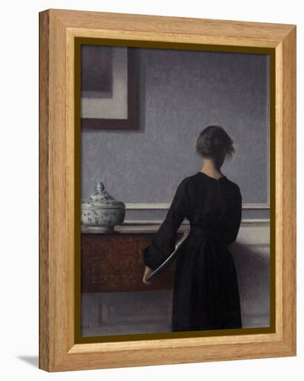 Interior with Young Woman from Behind-Vilhelm Hammershoi-Framed Premier Image Canvas