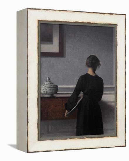 Interior with Young Woman from Behind-Vilhelm Hammershoi-Framed Premier Image Canvas