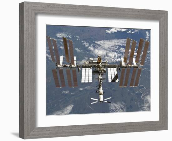 International Space Station Backgropped by a Blue and White Earth-Stocktrek Images-Framed Photographic Print