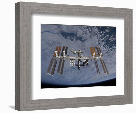 International Space Station Set Against the Background of a Cloud Covered Earth-null-Framed Photographic Print