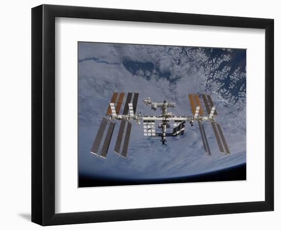 International Space Station Set Against the Background of a Cloud Covered Earth-null-Framed Photographic Print