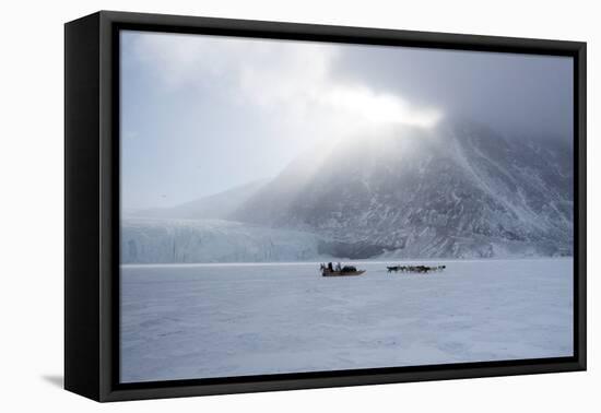 Inuit Hunter and His Dog Team Travelling on the Sea Ice, Greenland, Denmark, Polar Regions-Louise Murray-Framed Premier Image Canvas