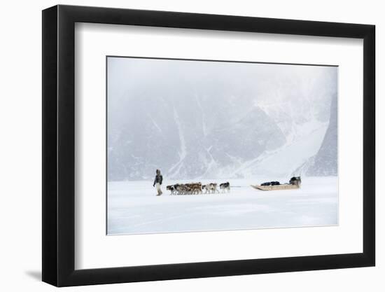 Inuit Hunter Walking His Dog Team on the Sea Ice in a Snow Storm, Greenland, Denmark, Polar Regions-Louise Murray-Framed Photographic Print