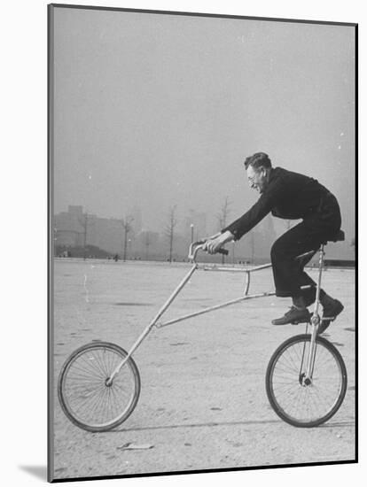 Inventor Maurice Steinlauf Riding Eccentric Bike with Roving Front Wheel-Wallace Kirkland-Mounted Photographic Print