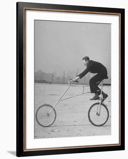 Inventor Maurice Steinlauf Riding Eccentric Bike with Roving Front Wheel-Wallace Kirkland-Framed Photographic Print