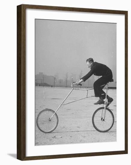 Inventor Maurice Steinlauf Riding Eccentric Bike with Roving Front Wheel-Wallace Kirkland-Framed Photographic Print