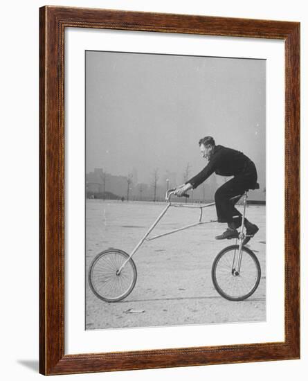 Inventor Maurice Steinlauf Riding Eccentric Bike with Roving Front Wheel-Wallace Kirkland-Framed Photographic Print