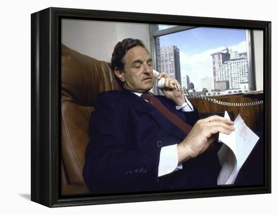 Investment Banker George Soros Working on Phone in Office-null-Framed Premier Image Canvas