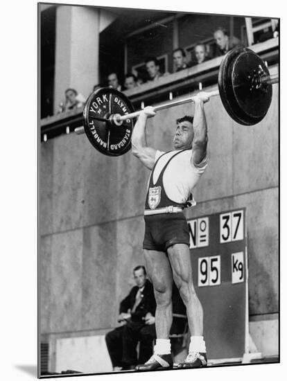 Iranian Weight Lifter M. Namdjou Struggling to Hold Up 206.5 Pound Weight at 1952 Olympics-null-Mounted Premium Photographic Print