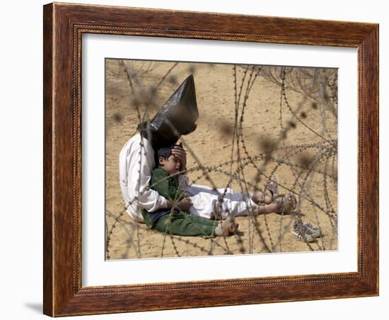 Iraqi Prisoner of War Confort His 4-Year-Old Son at a Regroupment Center for POWs Near Najaf-null-Framed Photographic Print