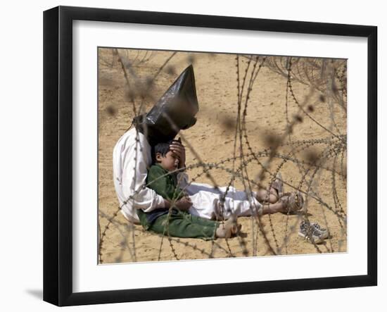 Iraqi Prisoner of War Confort His 4-Year-Old Son at a Regroupment Center for POWs Near Najaf-null-Framed Photographic Print