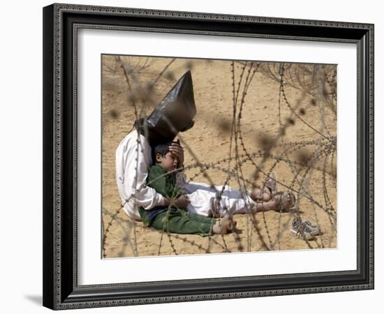 Iraqi Prisoner of War Confort His 4-Year-Old Son at a Regroupment Center for POWs Near Najaf-null-Framed Photographic Print