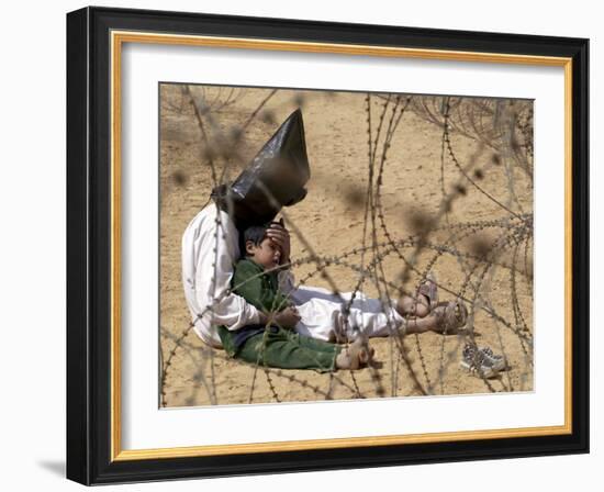 Iraqi Prisoner of War Confort His 4-Year-Old Son at a Regroupment Center for POWs Near Najaf-null-Framed Photographic Print