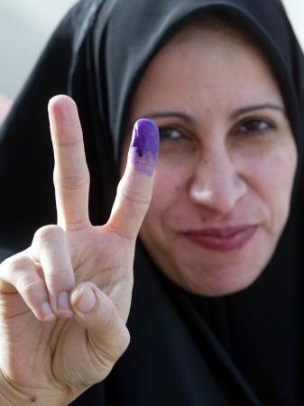 iraqi-woman-holds-up-her-purple-finger-indicating-she-has-just-voted-in-southern-iraq_u-l-q10onsi0.jpg