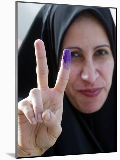 Iraqi Woman Holds Up Her Purple Finger, Indicating She Has Just Voted in Southern Iraq-null-Mounted Photographic Print