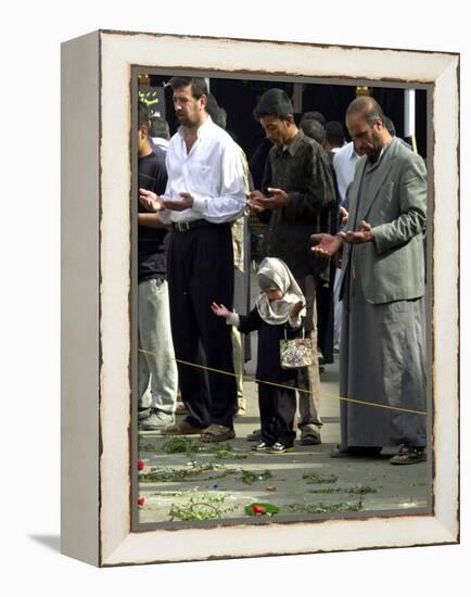 Iraqis, Inluding a Little Girl, Pause to Pray-null-Framed Premier Image Canvas