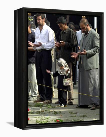 Iraqis, Inluding a Little Girl, Pause to Pray-null-Framed Premier Image Canvas