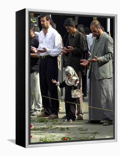 Iraqis, Inluding a Little Girl, Pause to Pray-null-Framed Premier Image Canvas