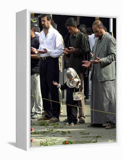 Iraqis, Inluding a Little Girl, Pause to Pray-null-Framed Premier Image Canvas