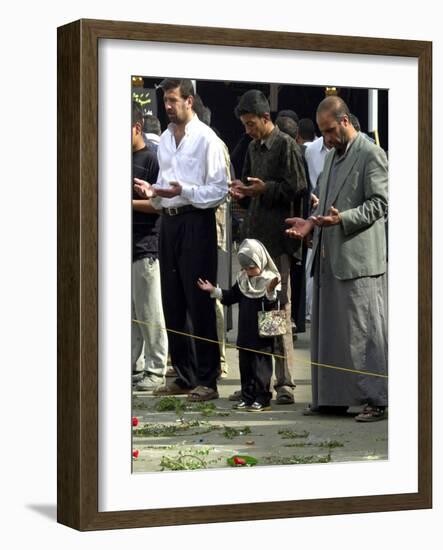 Iraqis, Inluding a Little Girl, Pause to Pray-null-Framed Photographic Print