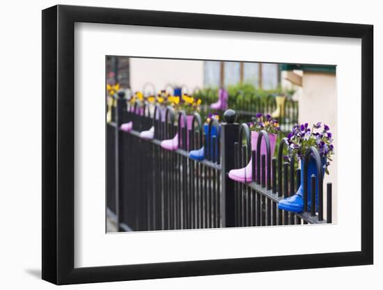 Ireland, County Kerry Cloghane, fence decorated with children's boots-Walter Bibikow-Framed Photographic Print