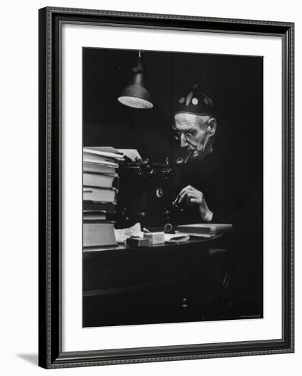 Irish Playwright Sean O'Casey with Pipe in His Mouth as He Works at His Typewriter at Home-Gjon Mili-Framed Premium Photographic Print