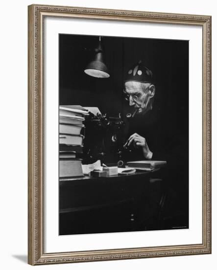 Irish Playwright Sean O'Casey with Pipe in His Mouth as He Works at His Typewriter at Home-Gjon Mili-Framed Premium Photographic Print