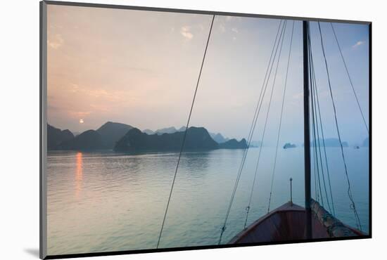 Islands and boat in the Pacific Ocean, Ha Long Bay, Quang Ninh Province, Vietnam-null-Mounted Photographic Print