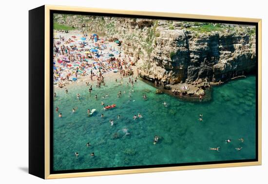 Italia, Apulia, Polignano a Mare. Crowded beach on a weekend. green.-Michele Molinari-Framed Premier Image Canvas