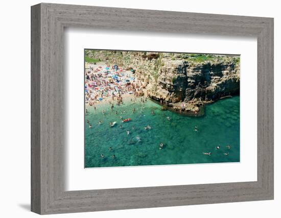 Italia, Apulia, Polignano a Mare. Crowded beach on a weekend. green.-Michele Molinari-Framed Photographic Print