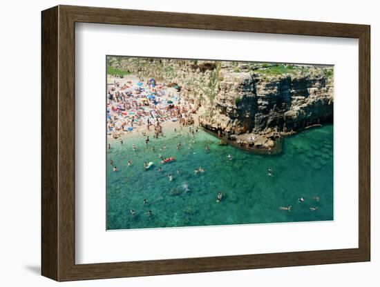 Italia, Apulia, Polignano a Mare. Crowded beach on a weekend. green.-Michele Molinari-Framed Photographic Print
