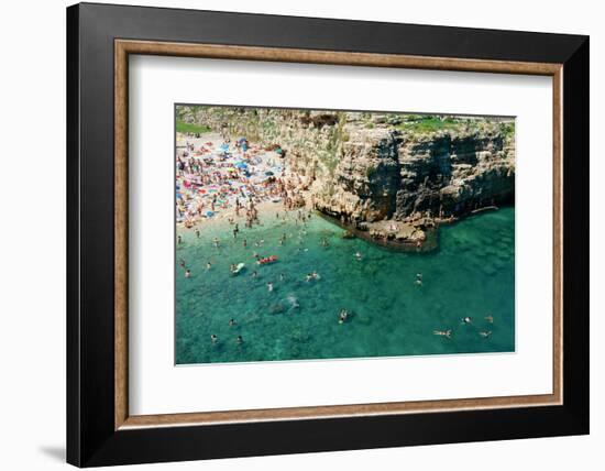 Italia, Apulia, Polignano a Mare. Crowded beach on a weekend. green.-Michele Molinari-Framed Photographic Print