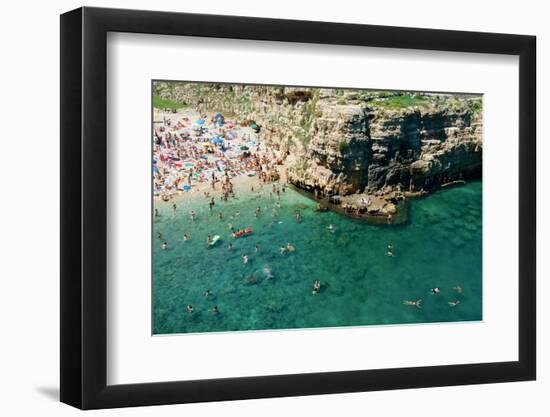 Italia, Apulia, Polignano a Mare. Crowded beach on a weekend. green.-Michele Molinari-Framed Photographic Print