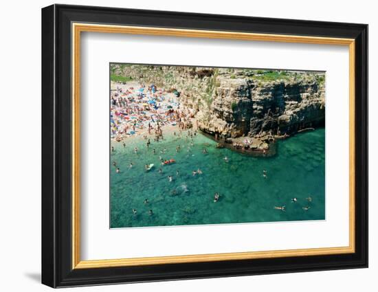 Italia, Apulia, Polignano a Mare. Crowded beach on a weekend. green.-Michele Molinari-Framed Photographic Print