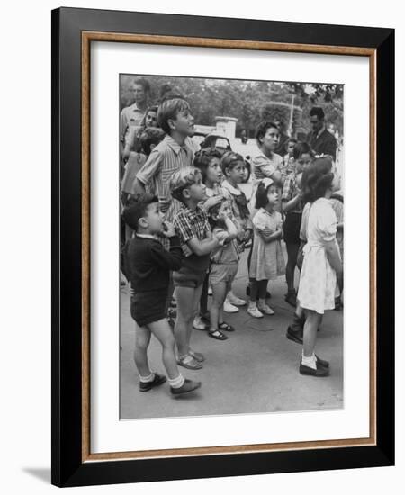 Italian Kids Watching Outdoor Puppet Show-Dmitri Kessel-Framed Photographic Print