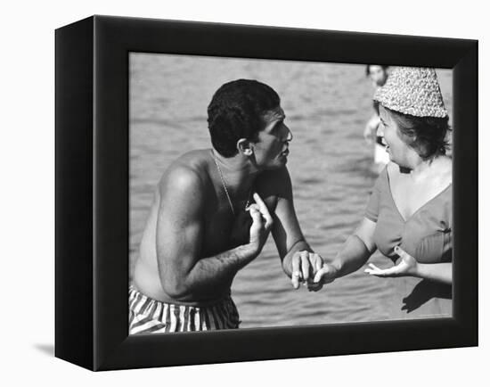 Italian Man Talking to a Woman While Enjoying a Day at the Beach-Paul Schutzer-Framed Premier Image Canvas