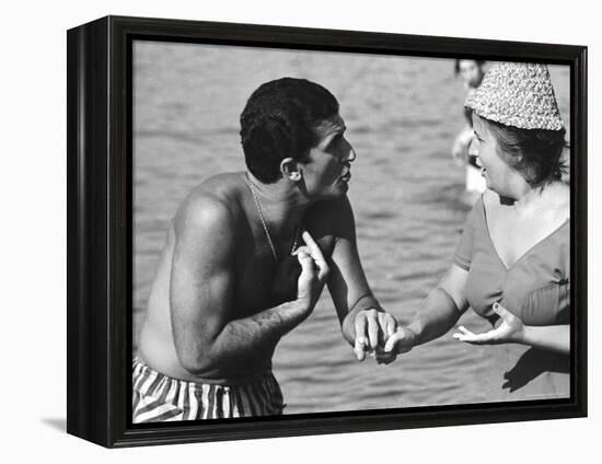 Italian Man Talking to a Woman While Enjoying a Day at the Beach-Paul Schutzer-Framed Premier Image Canvas